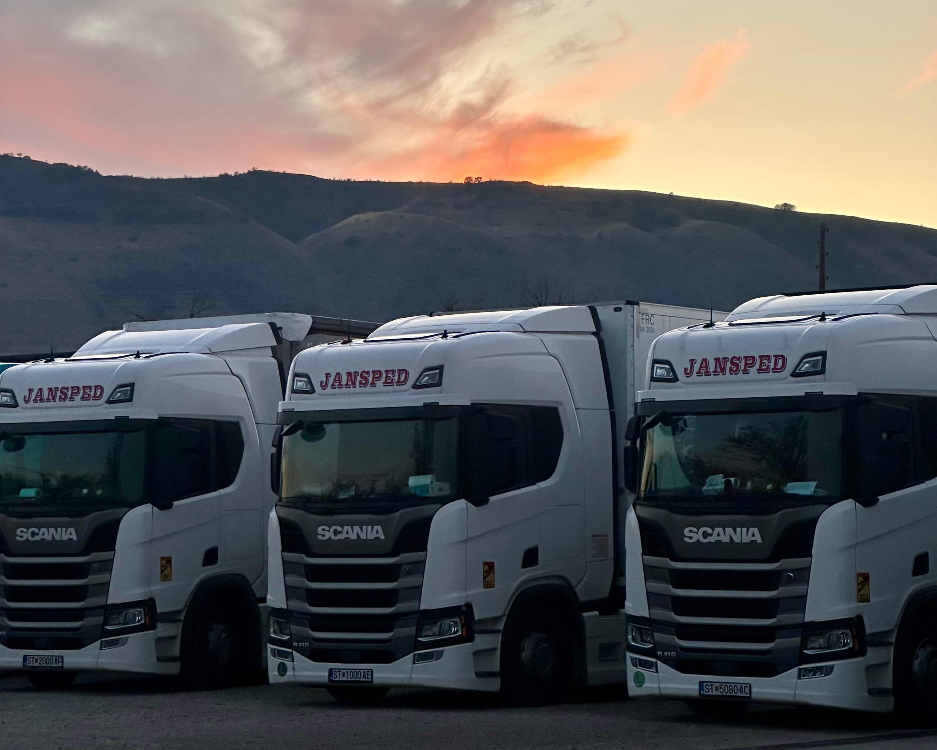 JANSPED truck driving at sunset on European road